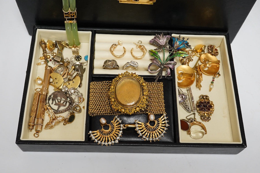 A jewellery box containing a quantity of mixed costume and other jewellery, including two yellow metal overlaid propelling pencils and a 14k and baroque pearl ring. Condition - poor to fair to good